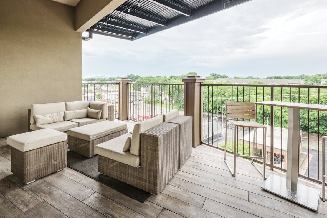 Balcony with views and seating attached to resident lounge.