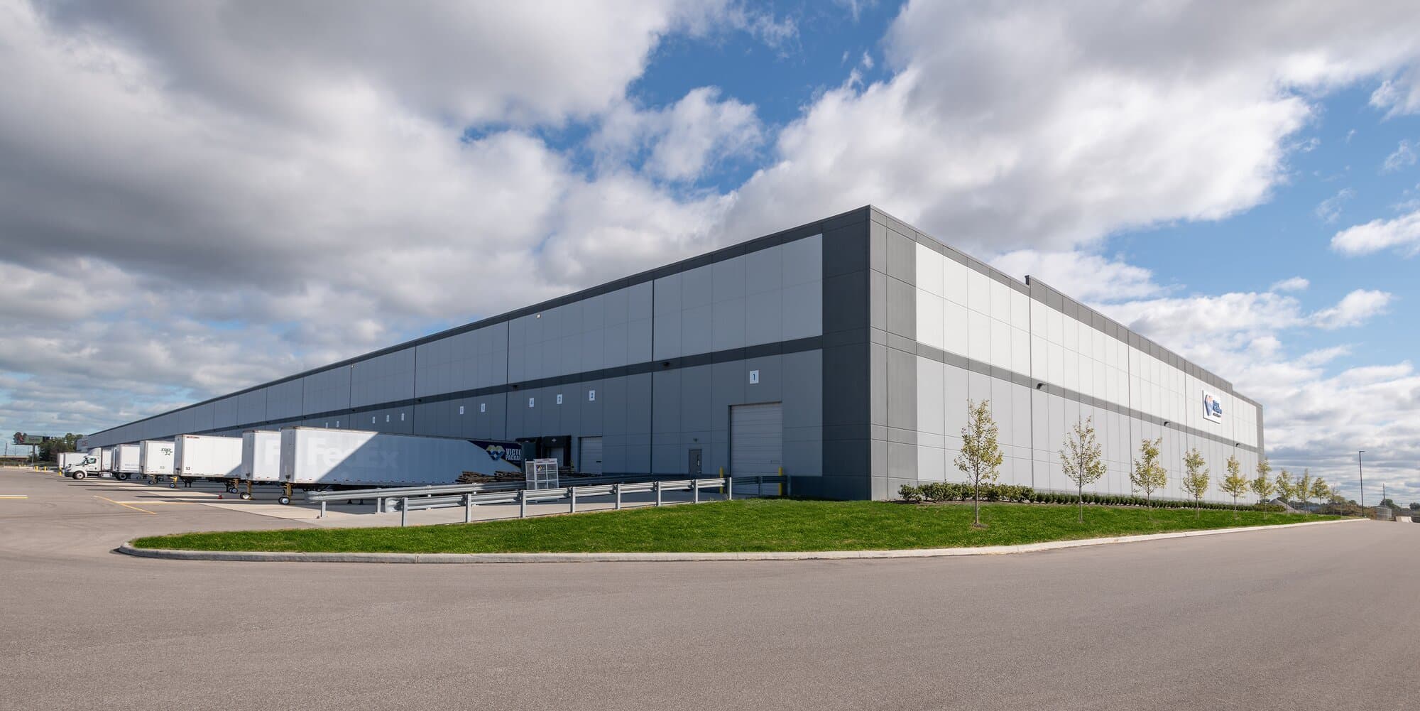 Exterior image of bay spacing with trucks.