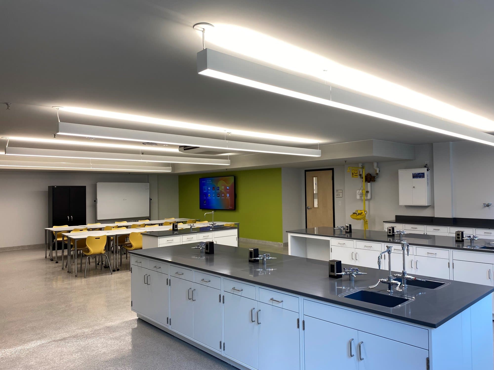 Sink stations line the countertops of an educational science lab.