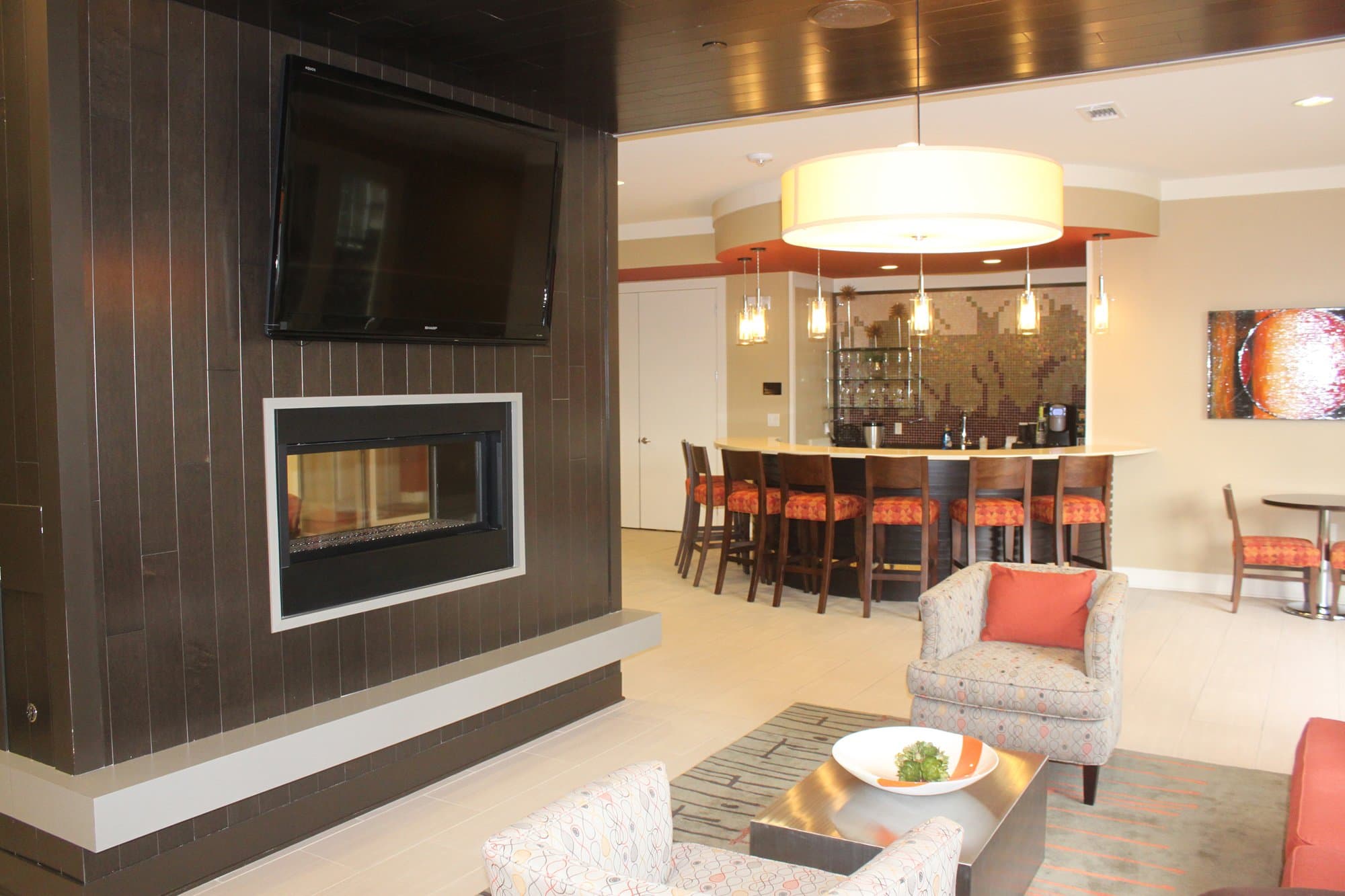 Fireplace in lobby and bar area.