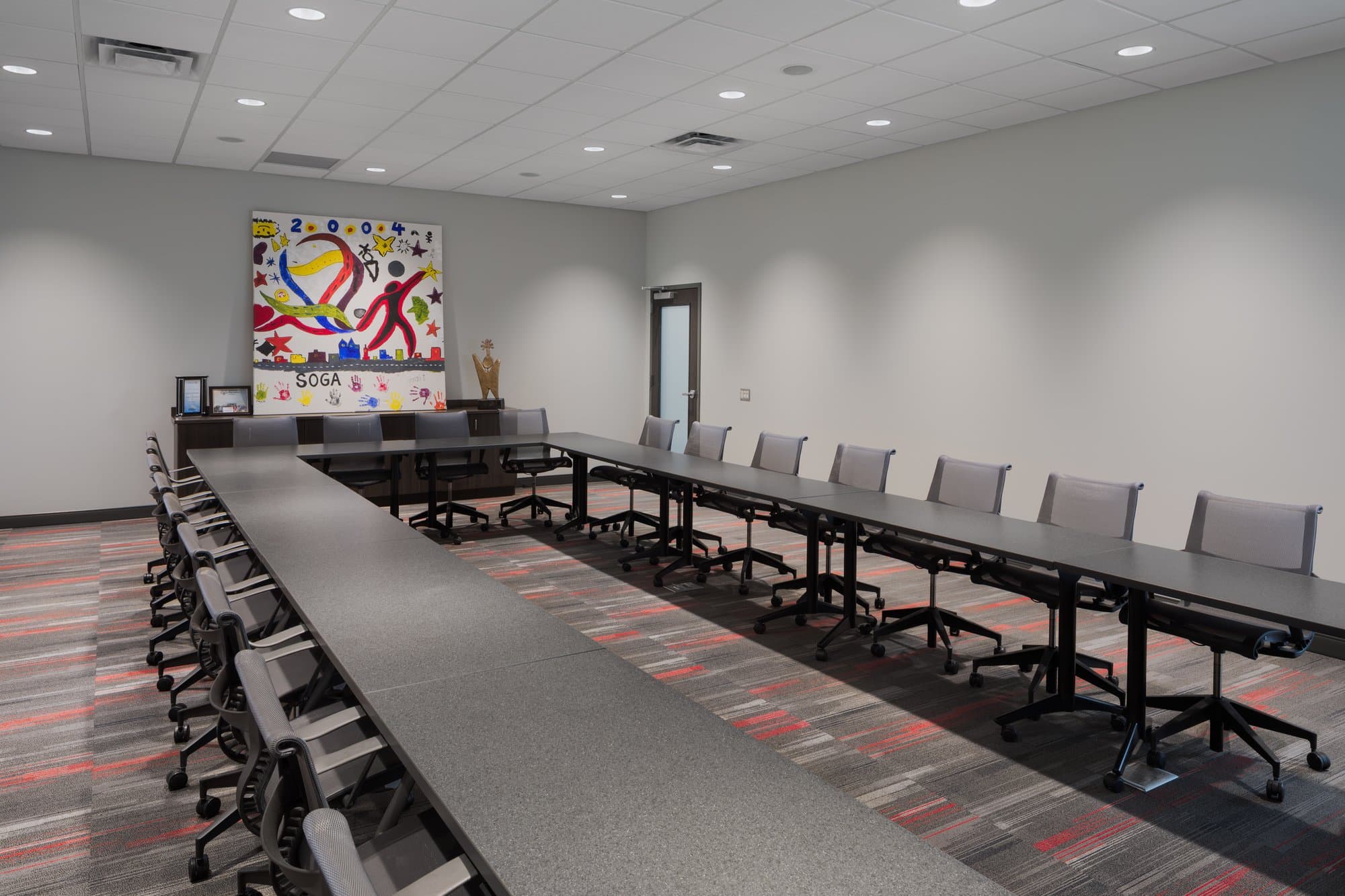 large conference room with tables arranged in a rectangle