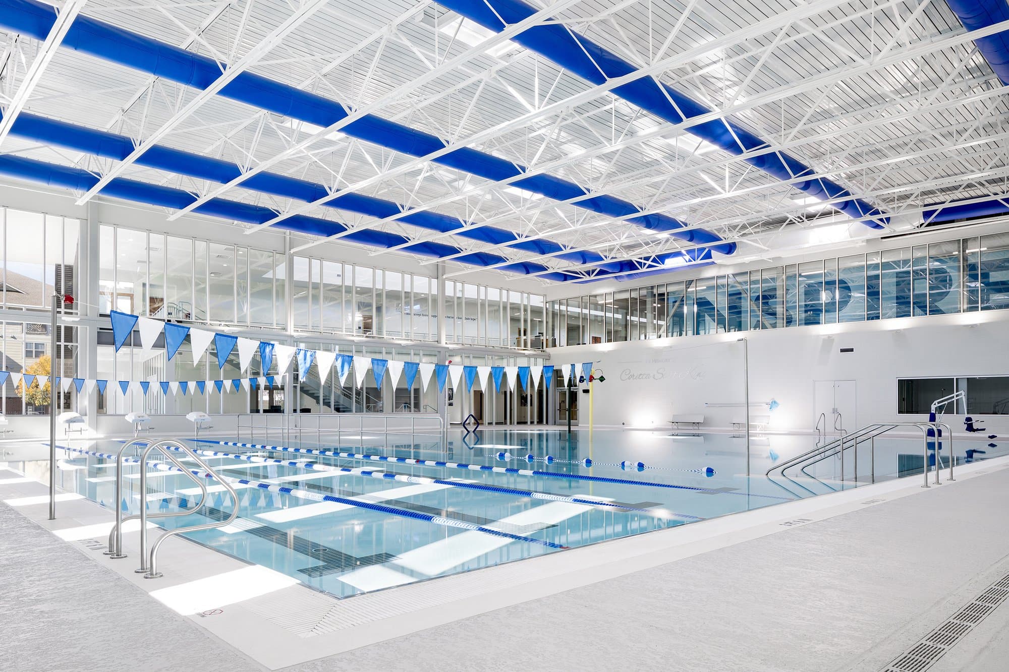 indoor swimming pool with four lanes and an open swimming area