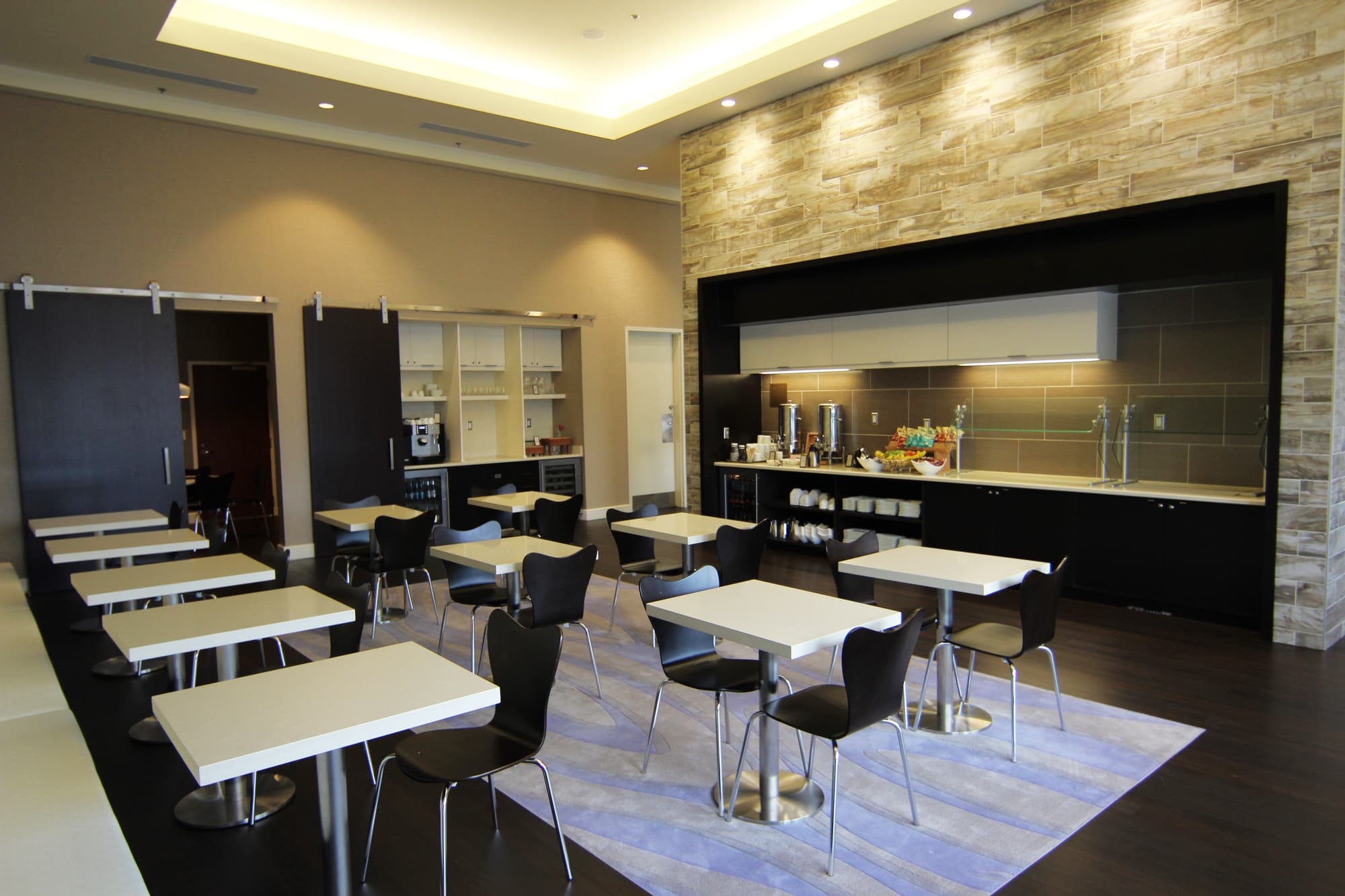 Hotel lounge area with seating and tables.