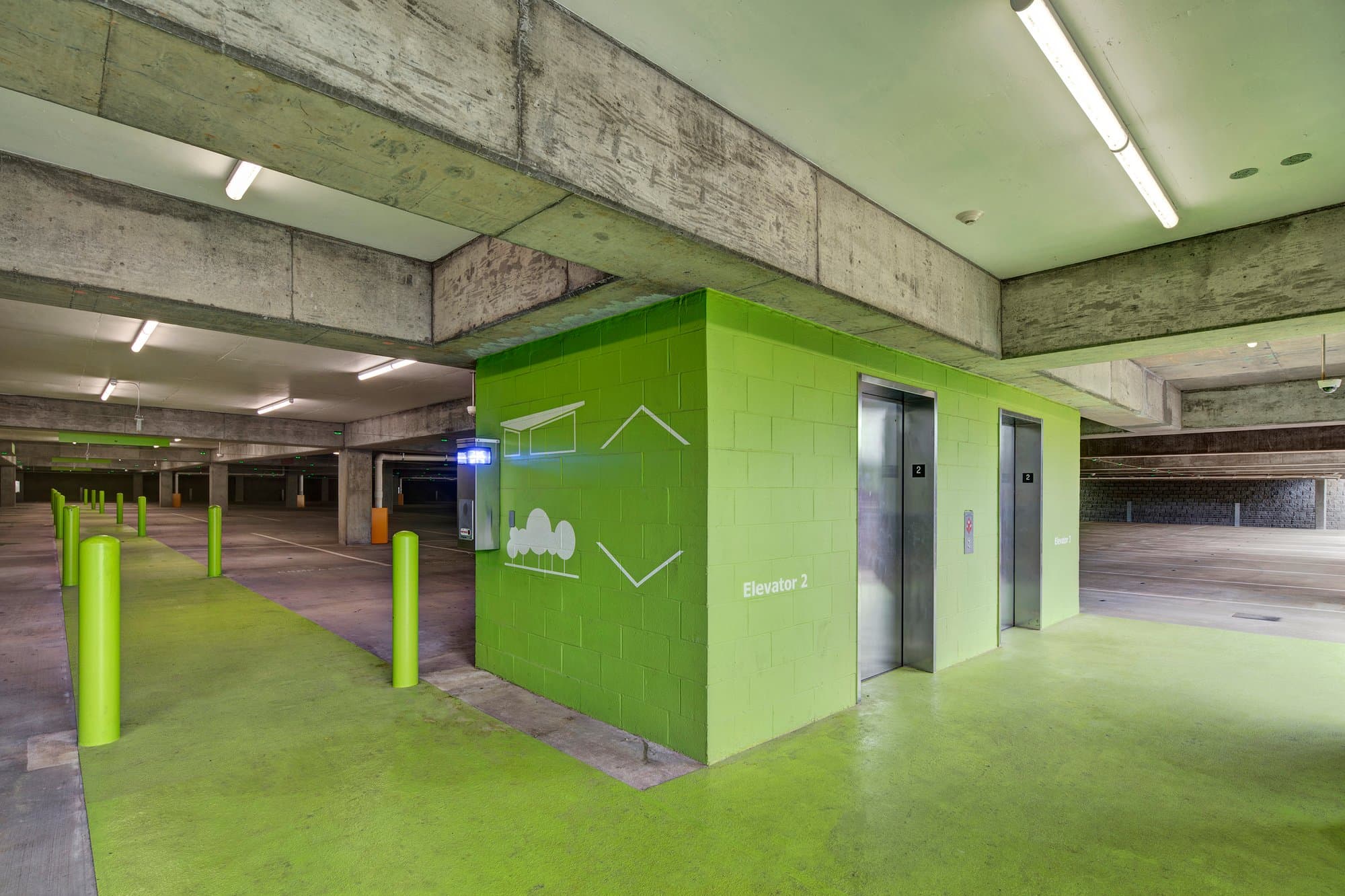 Elevators inside of parking garage.