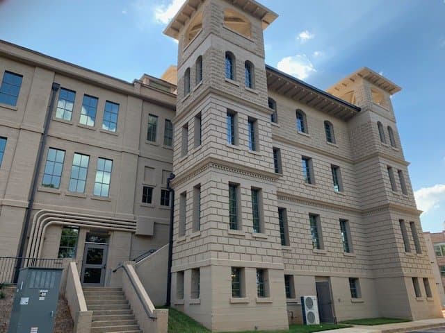 A large building with stairs leading up to it.