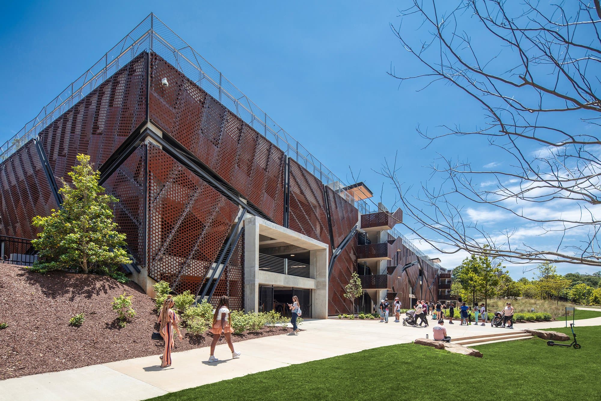 Rendering of parking garage with people walking by.